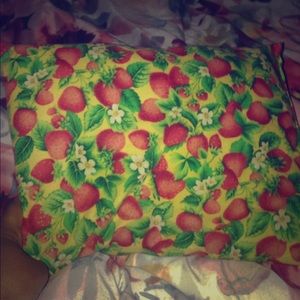A strawberry baby pillow